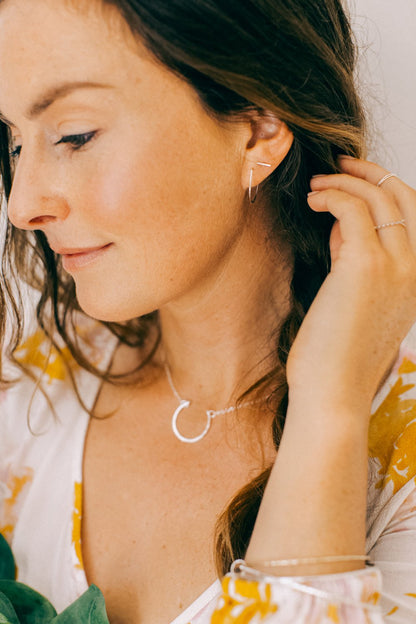 Lightweight gold hoop earrings with hammered texture