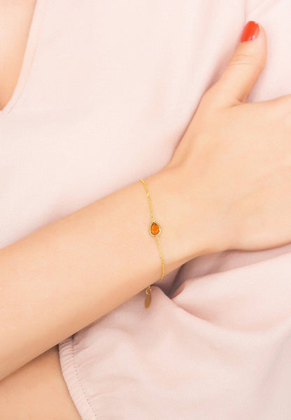 Gold citrine teardrop bracelet on wrist