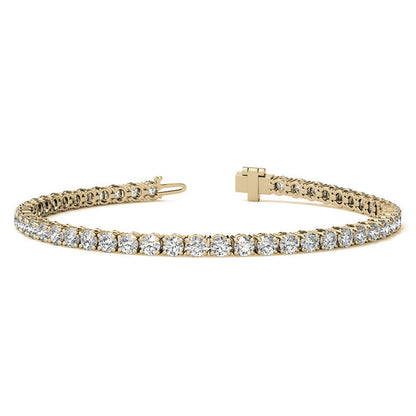 Gold bracelet with diamond accents on a white background