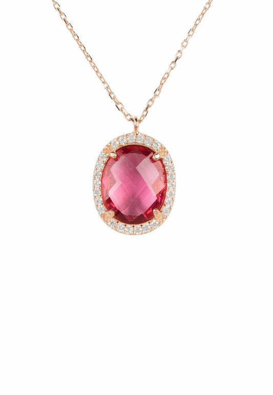 A gold-plated pendant necklace featuring an oval-shaped pink tourmaline gemstone surrounded by smaller cubic zirconia accents.
